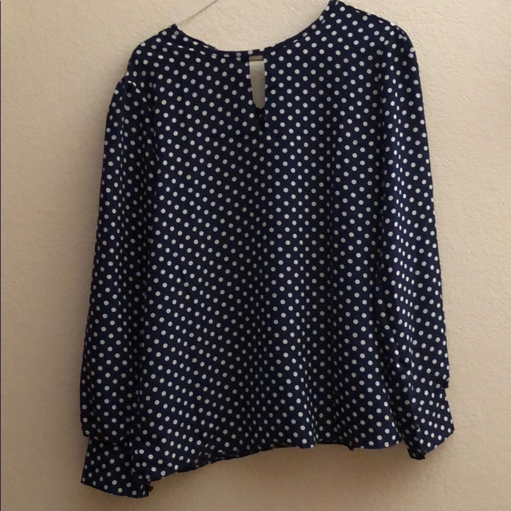Navy blue and white polka dot blouse